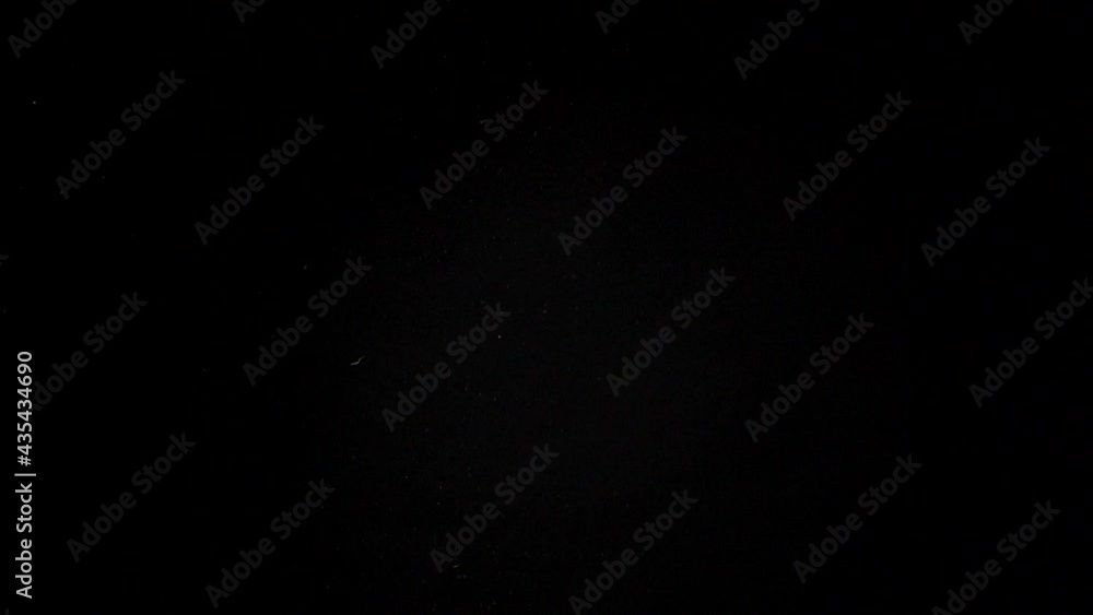 Colorful uncooked pasta flying on black background. Slow-motion Colorful uncooked pasta flying on black background. Slow-motion