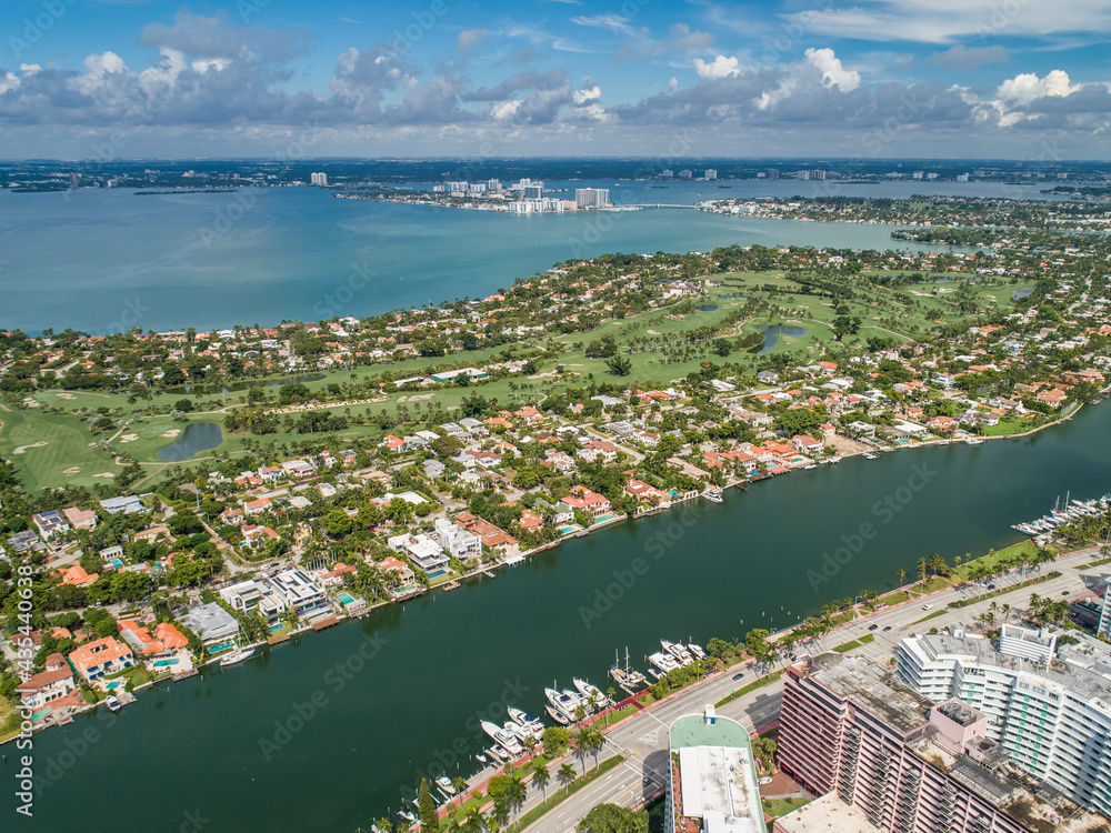Aerial waterway of waterfront properties Miami Beach along Collins and Pine Tree Drive La Gorce Golf Course