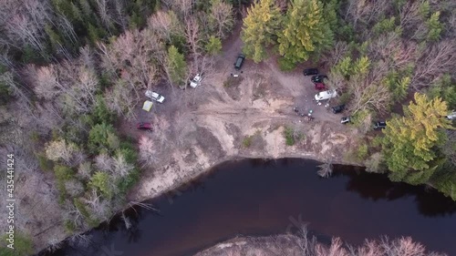 Overland Camping On Remote Forest Near Leota With Muskegon River In Michigan. - Aerial Shot photo