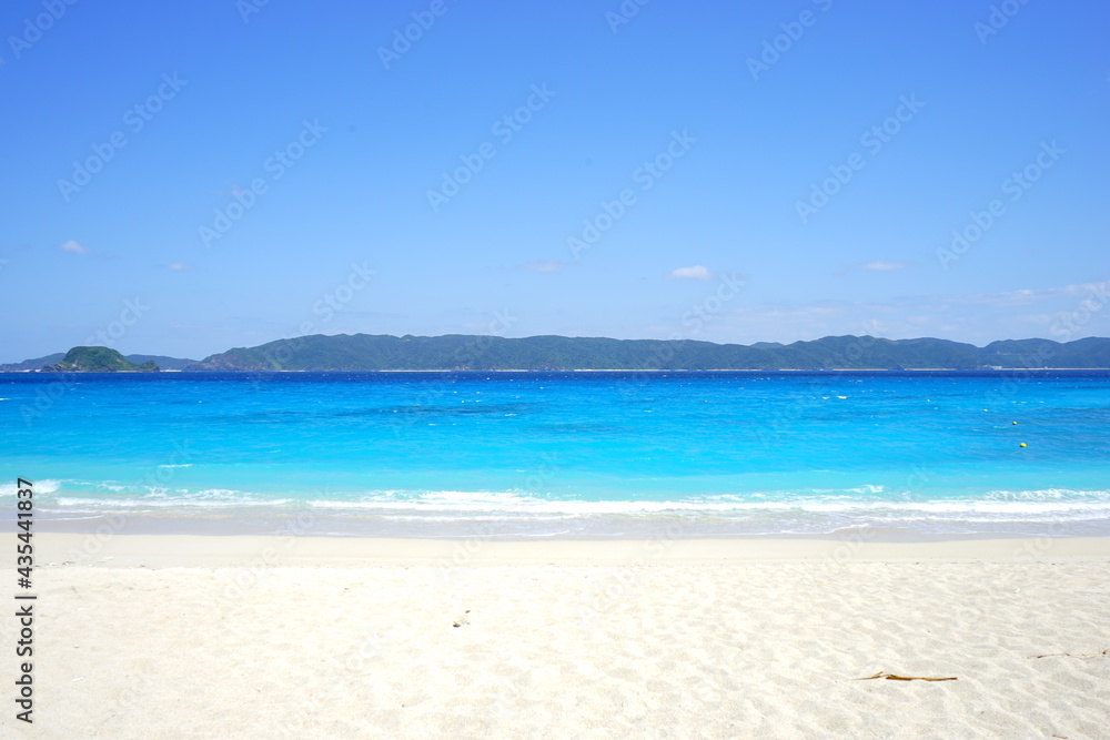 Beautiful summer scenery. calm waves on the blue water. Furuzamami Beach in Zamami island, Okinawa, Japan - 日本 沖縄 座間味島 古座間味ビーチ 青い海	