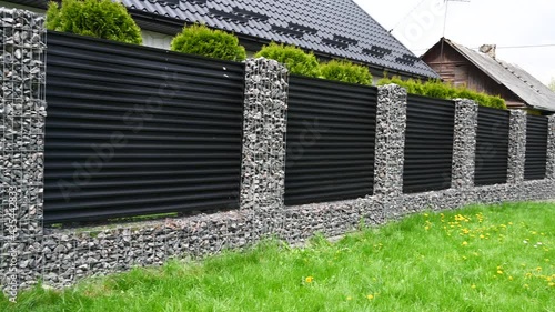 New build gabions fence. Gabion fence. 