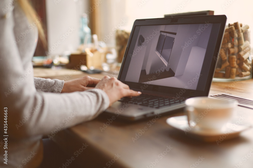Hands of a woman working on a laptop. A freelance worker completes an order in a cafe. Hands of a woman working on a laptop. A freelance worker completes an order in a cafe.