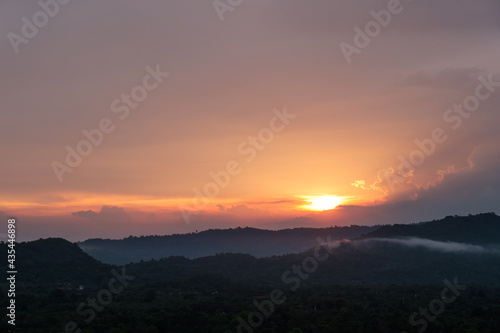 Seeing Sunset in cloudy day and the fog in the mountain.