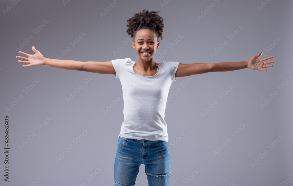 Joyful exuberant young woman grinning happily at the camera
