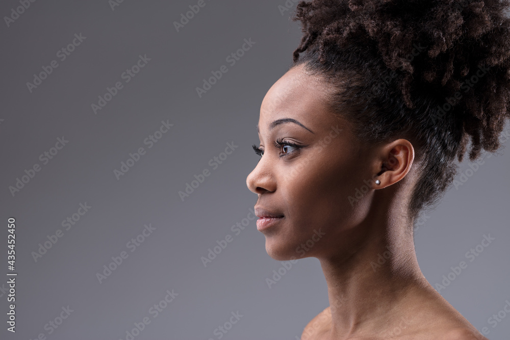 Side profile portrait of a beautiful black woman. Stock Photo