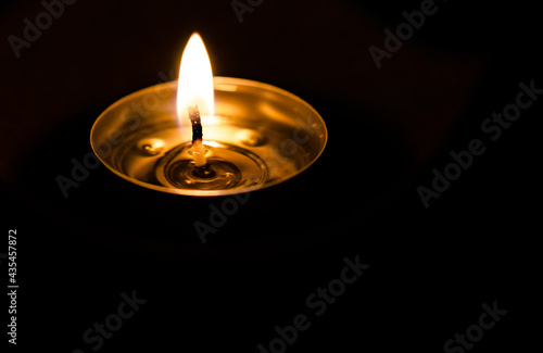 Candle flame on black background 