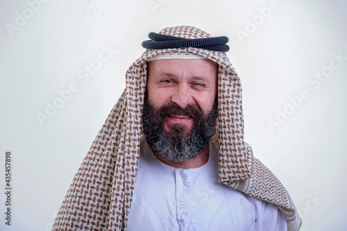 Emotional arabic man posing on white background