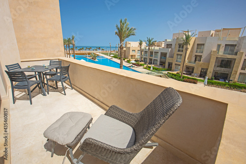 Terrace balcony with chairs in tropical luxury apartment resort