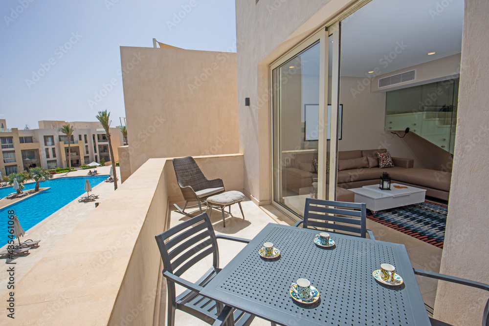 Fototapeta premium Terrace balcony with chairs in tropical luxury apartment resort