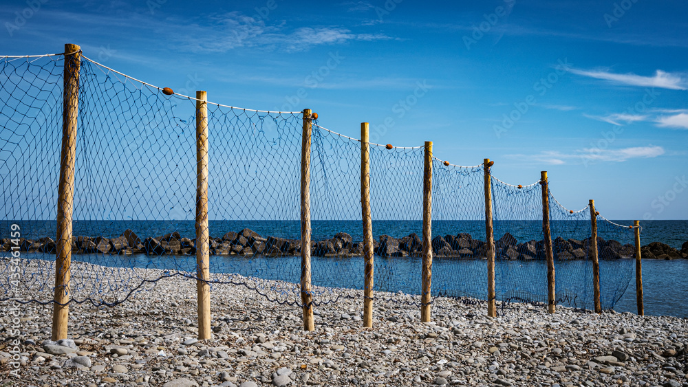 Fototapeta premium Pioppi beach, Cilento, Campania, Italy. Pebbles, blue sea and blue sky