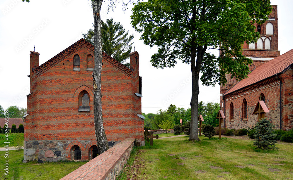 General view and close-ups of architectural details of the funeral chapel at the Catholic Church of the Assumption of the Blessed Virgin Mary, in the town of Galiny, warmi, Poland.