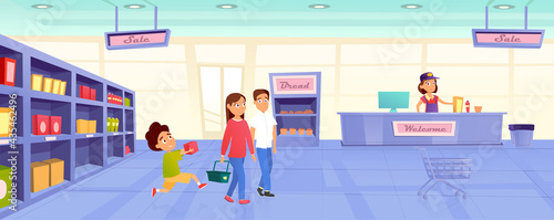 cheerful family shopping at the grocery store, the seller behind the counter smiles at the visitors