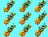 Fruit pattern with organic pineapples on bright azure background