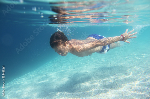 Boy swimming underwater