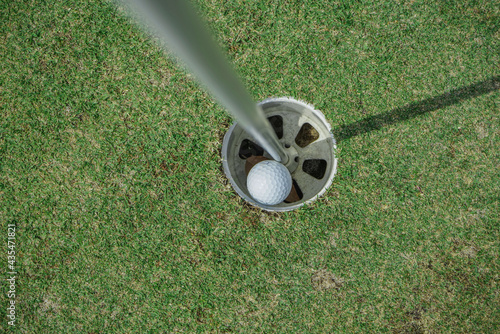 Hole in One. Golf ball in the hole.