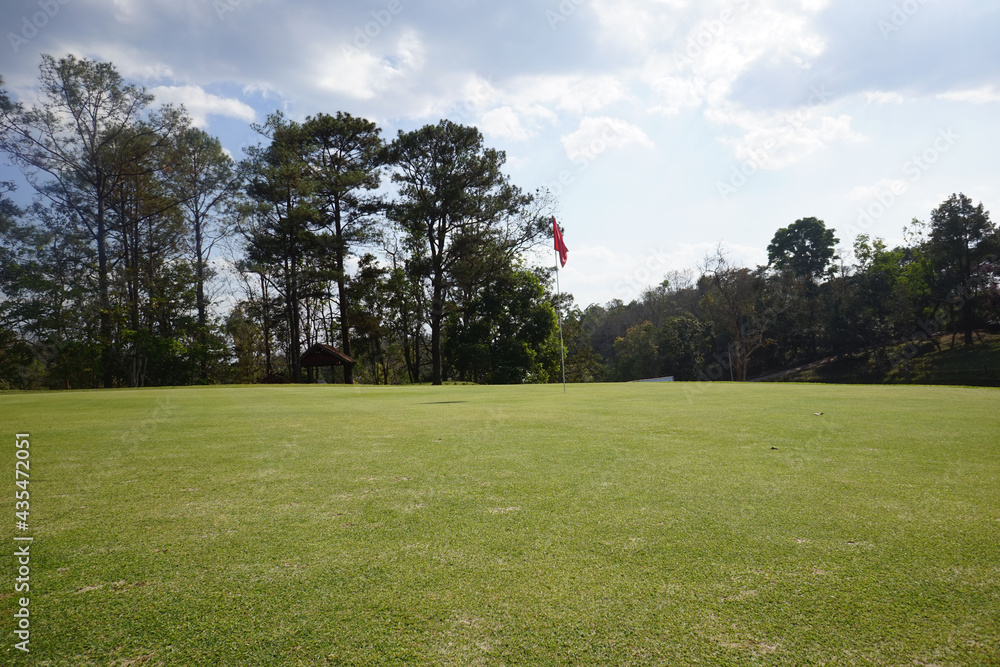 Landscape of a beautiful golf course at the sunset in the countryside.