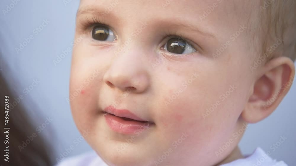 Beautiful happy family. Smiling baby face. Happy family. Happy baby face. Macro close-up of a kid face. Happy family concept Beautiful happy family. Smiling baby face. Happy family. Happy baby face. Macro close-up of a kid face. Happy family concept