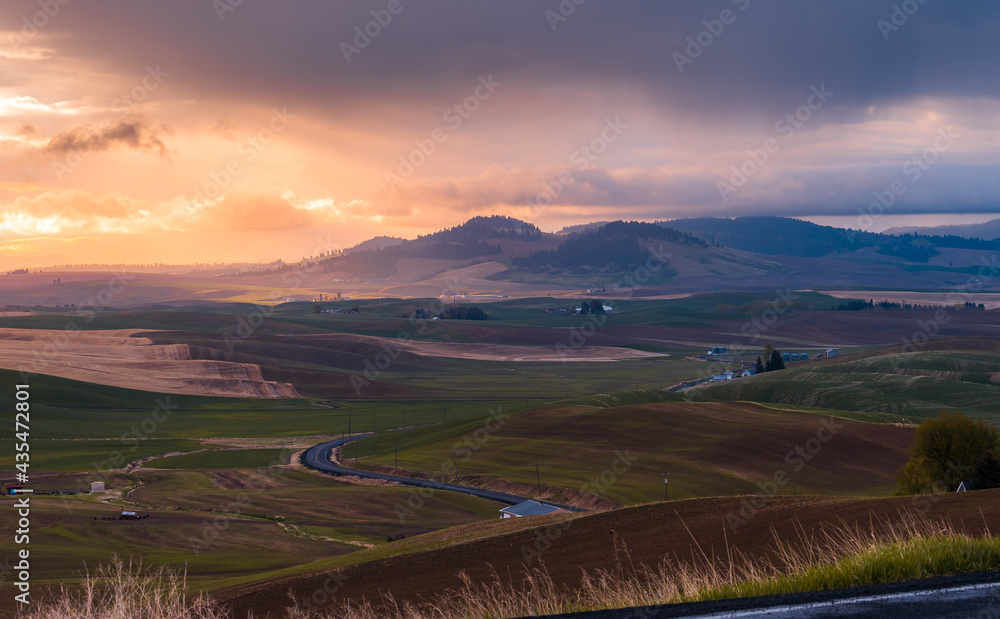 Panoramic view of clounds, mountains, farmland and rolling hill in Kamiak Butte County Park, Washington