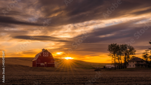 Picturesque Red Barn at sunset in Palouse Washington photo