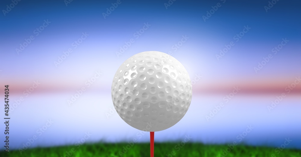 Composition of golf ball on golf course over blue blur Composition of golf ball on golf course over blue blur