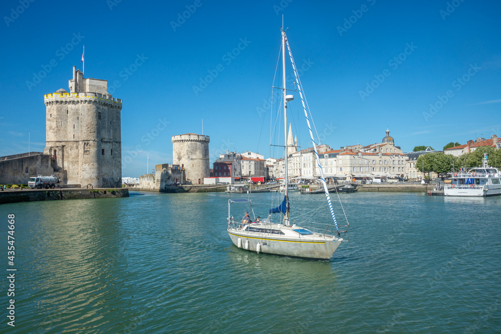Sailboat entering harbour at La Rochelle, Charente-Maritime, France