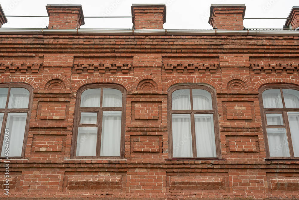 Windows in an old brick building. Red brick building.