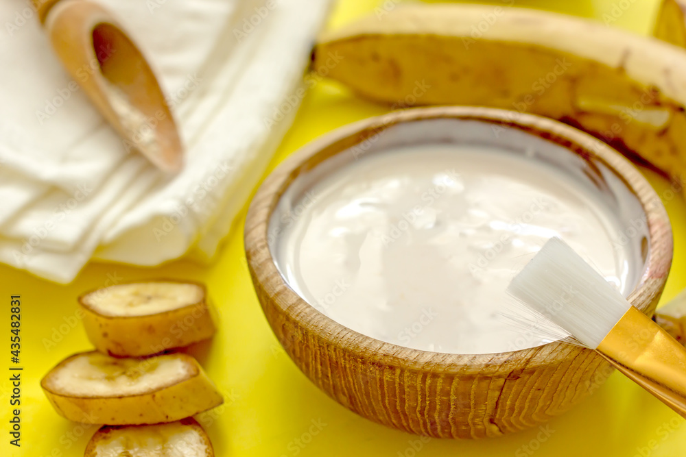 Homemade banana cosmetics. Cosmetic face mask with banana, oatmeal, honey, yolk. Natural skin care, wellness cosmetics,close-up. Diy banana mask,zero waste concept Homemade banana cosmetics. Cosmetic face mask with banana, oatmeal, honey, yolk. Natural skin care, wellness cosmetics,close-up. Diy banana mask,zero waste concept