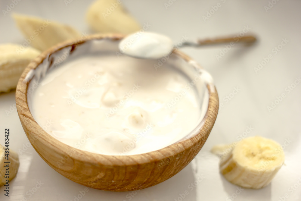 Homemade banana cosmetics. Cosmetic face mask with banana, oatmeal, honey, yolk. Natural skin care, wellness cosmetics,close-up. Diy banana mask,zero waste concept Homemade banana cosmetics. Cosmetic face mask with banana, oatmeal, honey, yolk. Natural skin care, wellness cosmetics,close-up. Diy banana mask,zero waste concept