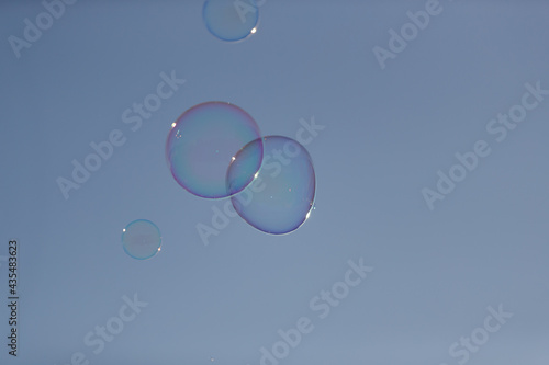 soap bubbles against blue sky
