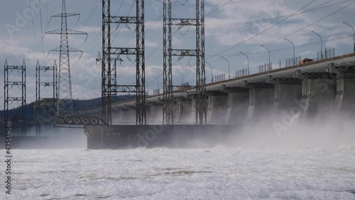 Hydroelectric power station on the Volga river. Large-scale construction with a road. photo