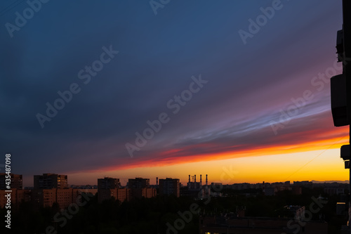 beautiful flaming sunset, the setting sun over the city falling asleep in the twilight, fantastic colors and shades that nature draws,sunrises sunsets