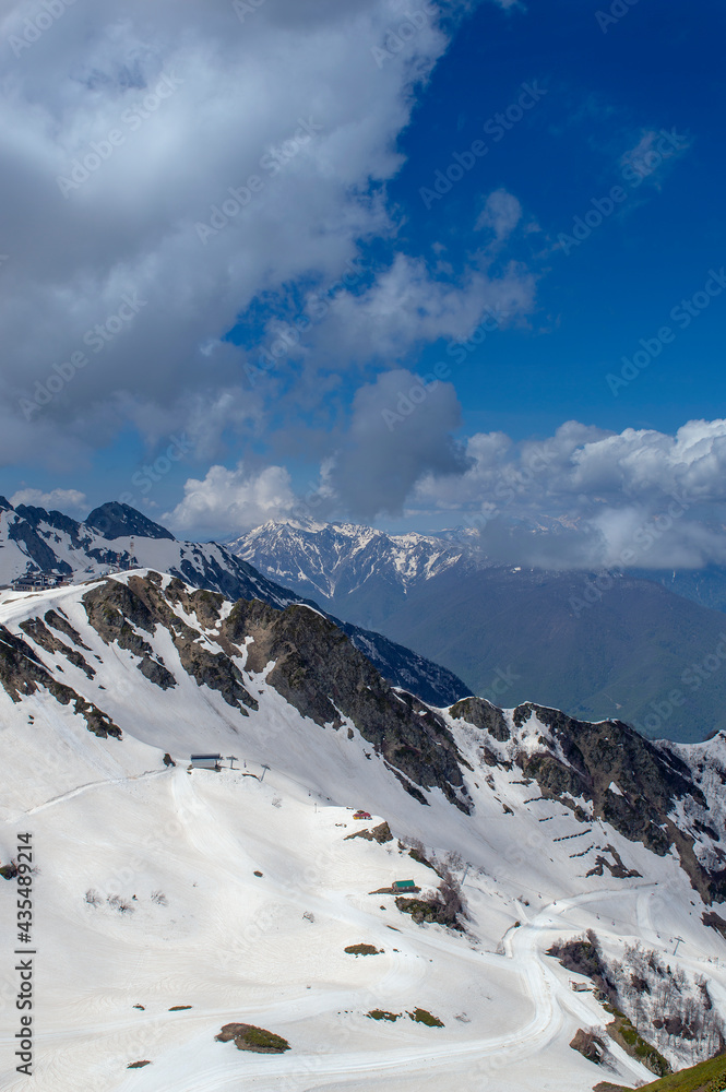 Beautiful snow-capped peaks of the Caucasus Mountains. Rosa Khutor Alpine Resort in Sochi. Krasnodar region. Russia.