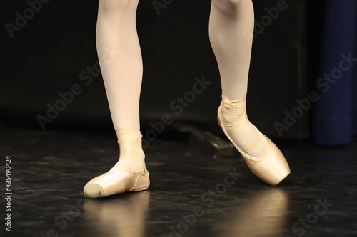 dancer legs in ballet shoes