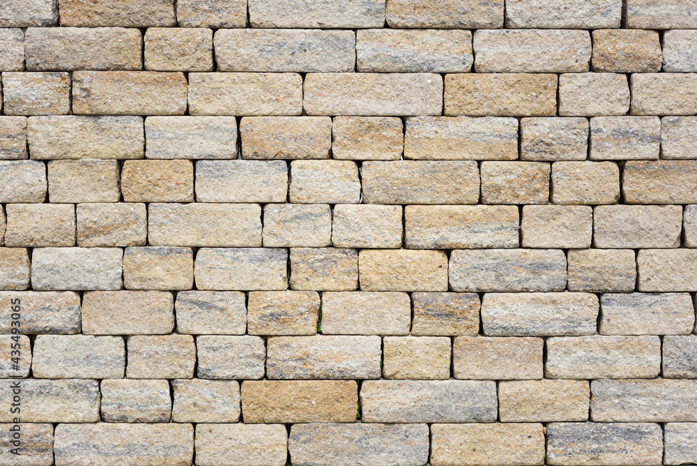 Texture of a wall made of rectangular bricks that form a gray brick wall Texture of a wall made of rectangular bricks that form a gray brick wall