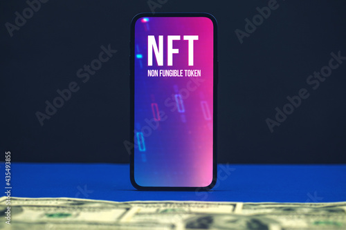 NFT non fungible token, Innovation technology background, logo on the screen