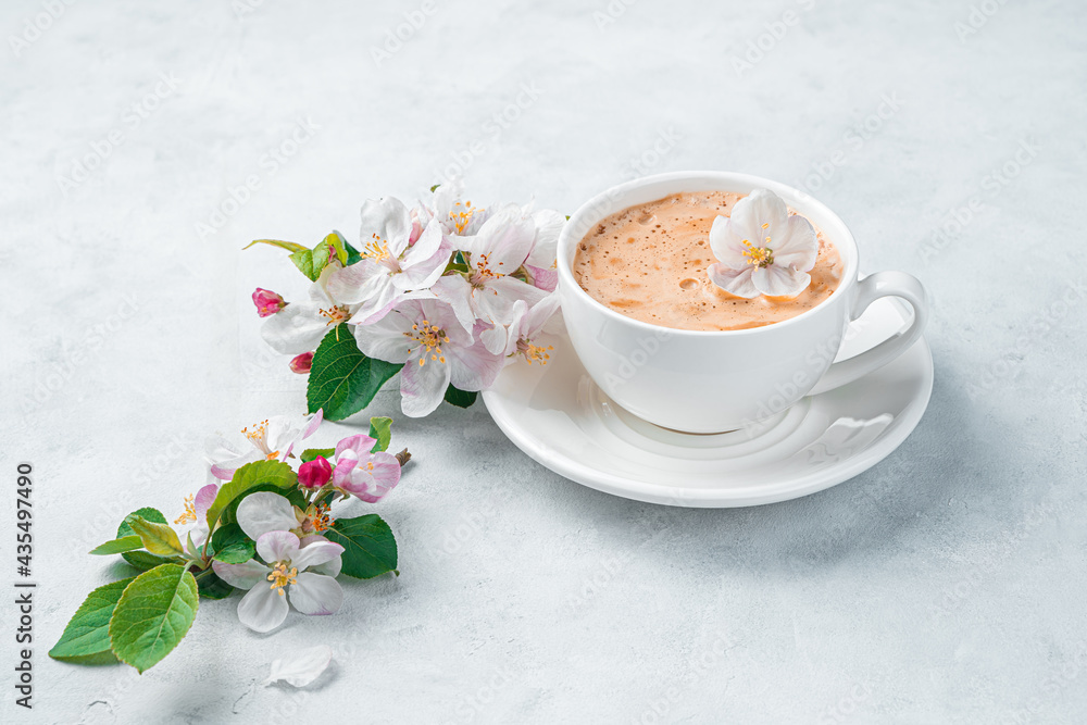 Fresh morning coffee and flowers on a light background. Side view, copy space. Fresh morning coffee and flowers on a light background. Side view, copy space.