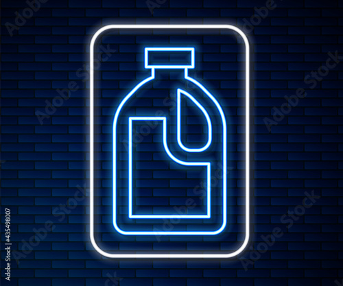 Glowing neon line Plastic bottle for laundry detergent, bleach, dishwashing liquid or another cleaning agent icon isolated on brick wall background. Vector
