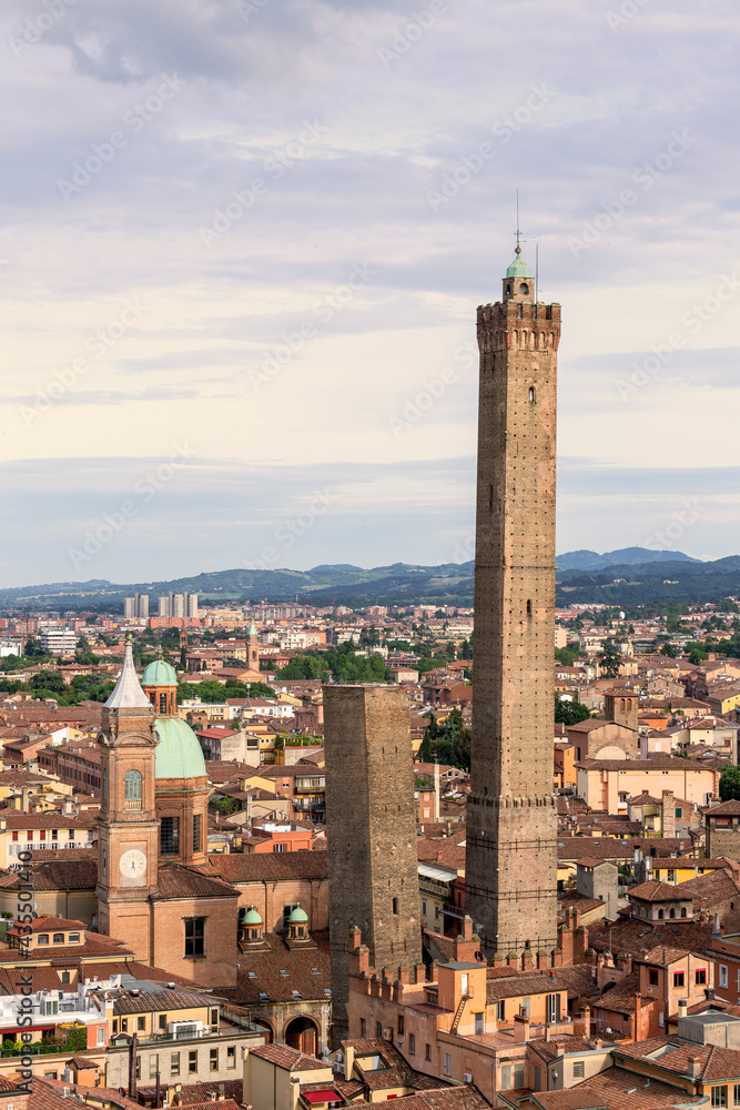 Two famous falling Bologna towers Asinelli and Garisenda. Evening view, Bologna, Emilia-Romagna, Italy.