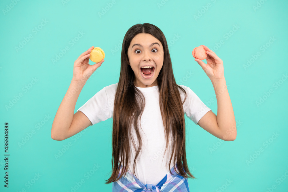 amazed teen girl hold french macaron or macaroon cookies, childhood amazed teen girl hold french macaron or macaroon cookies, childhood