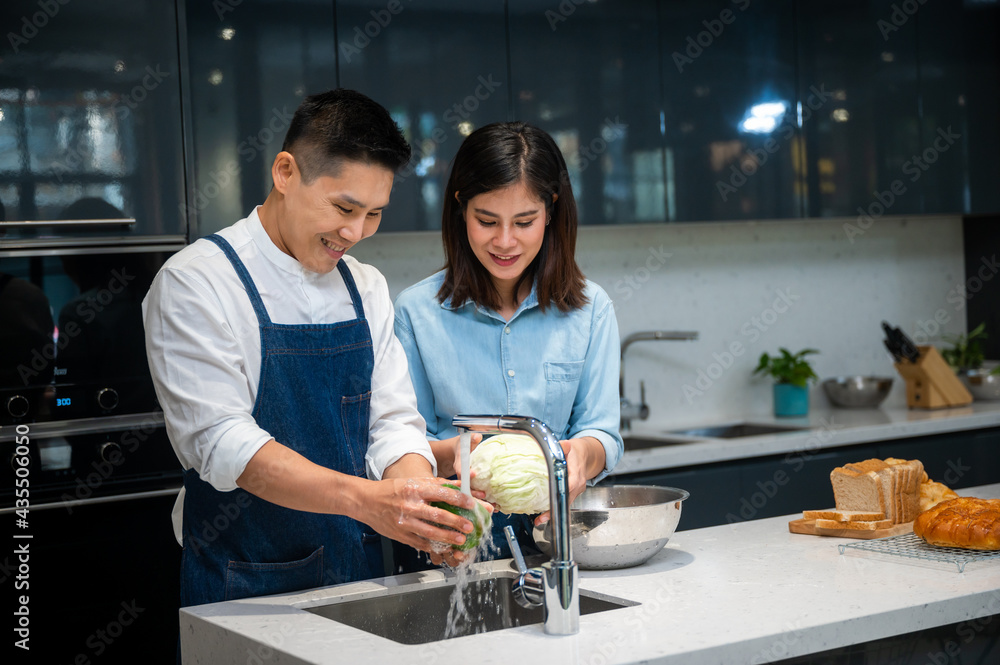 couple person cooking food in kitchen at home, woman and man are happy together with healthy meal food from vegetable, wife and husband in love lifestyle concept couple person cooking food in kitchen at home, woman and man are happy together with healthy meal food from vegetable, wife and husband in love lifestyle concept