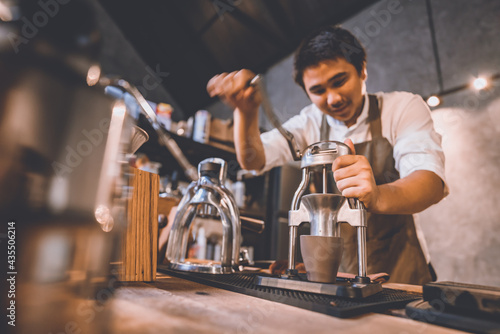 professional barista making hot drink of a fresh coffee in vintage cafe, cup of brown aroma hot espresso with milk, beverage caffeine for morning, coffee bean and breakfast background