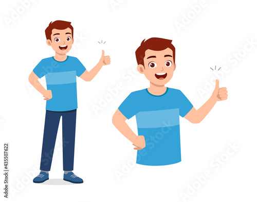 young good looking man doing thumb up pose
