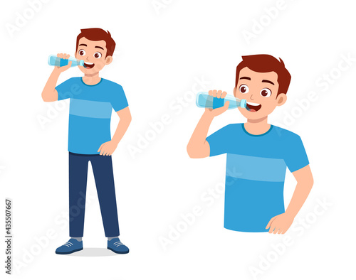 young good looking man drink water on bottle