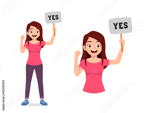 young good looking woman holding board said yes