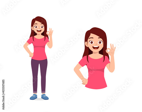 young good looking woman shows ok gesture