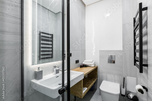 interior photo, small bathroom, with white marble tiles, and shower