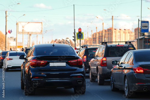 Background, blur, out of focus, bokeh. Traffic jams during rush hours after work. Red brake lights of stopped cars on the background of the city neighborhood. © Андрей Михайлов
