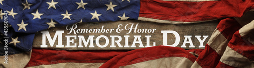 US American flag covering distressed and worn wood. Wallpaper for USA Memorial Day with Remember and Honor Memorial Day.