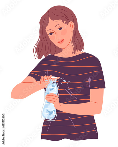 Girl opens a bottle of water to drink in the heat