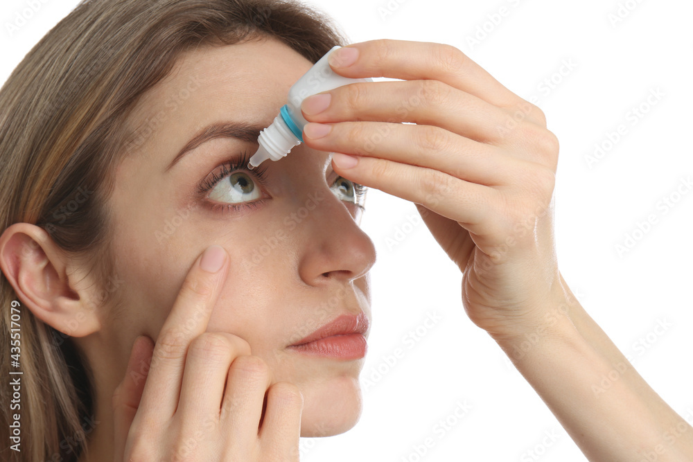 Young woman using eye drops on white background, closeup Young woman using eye drops on white background, closeup
